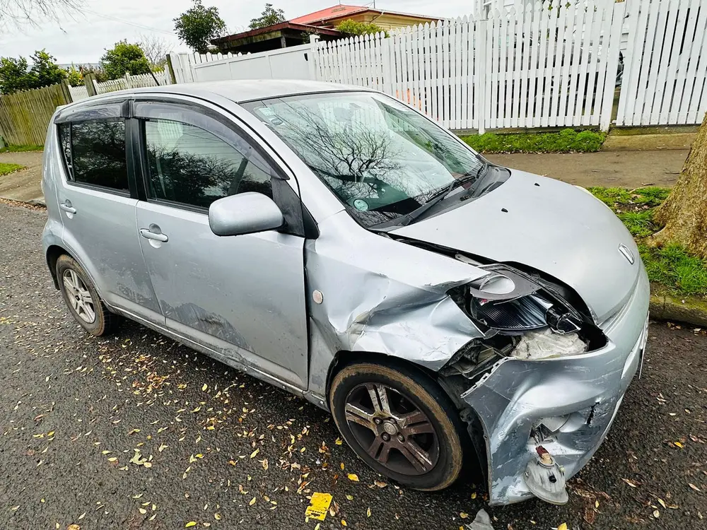 Daihatsu Boon with front-left accident damage